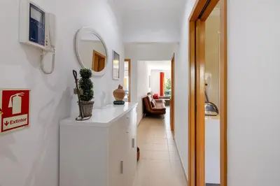 a hallway with a white counter and a mirror at Encosta São José in Guia