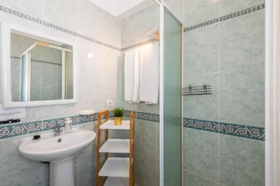 a bathroom with a sink and a shower at Villa Eulália in Guia