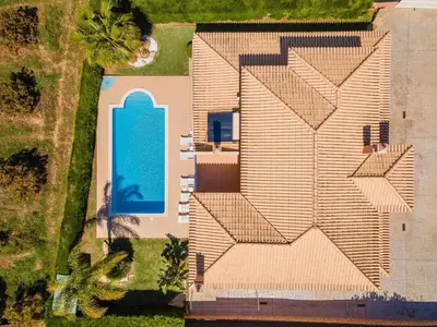 an overhead view of a house with a blue door at Villa Hunês in Guia
