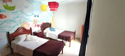 a bedroom with two beds and a fish themed wall at Apt 3 Quartos, Terraço, Centro, Prestige For Home in Loulé