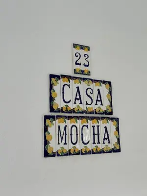 a sign that says casa mochica on a wall at Casa Mocha Vale do lobo 2 bed apartment in Loulé