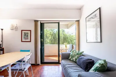 a living room with a couch and a table at Azure Vilamoura Apartment by HelloVacations in Loulé