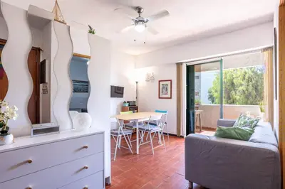 a living room with a couch and a table at Azure Vilamoura Apartment by HelloVacations in Loulé