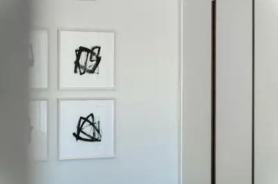 three framed drawings of shoes on a white wall at Villa Sole in Quinta do Lago by LovelyStay in Faro