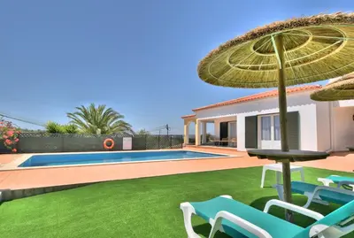 a villa with a swimming pool and a house at Villa Santa Maria Valley - Private Pool in Albufeira