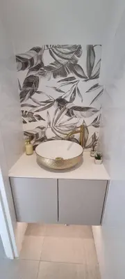a bathroom with a sink and a wall at T2 Marina Vilamoura in Quarteira