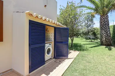 a washing machine in a door of a house at Villa Casa Pepa-Paca - Swiming Pool & Air Condition - Albufeira - Sesmarias - BY BEDZY in Albufeira