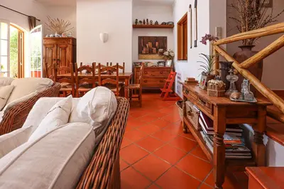 a living room with a couch and a table at Villa Casa Pepa-Paca - Swiming Pool & Air Condition - Albufeira - Sesmarias - BY BEDZY in Albufeira