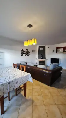 a living room with a couch and a table at Villa V3 - Vale Pedras in Albufeira