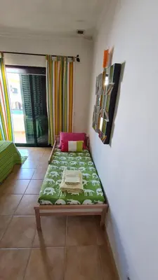 a bedroom with a bed in a room with a window at Villa V3 - Vale Pedras in Albufeira