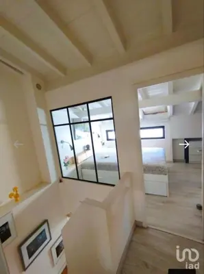 a living room with a large window in a room at Cozy House in Center in Faro