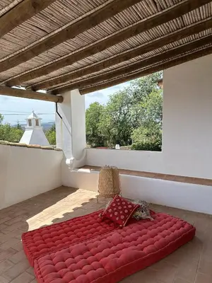 a room with a hallway with a table and a mirror at Almancil Sea and Countryside Secluded Villa in Quartos