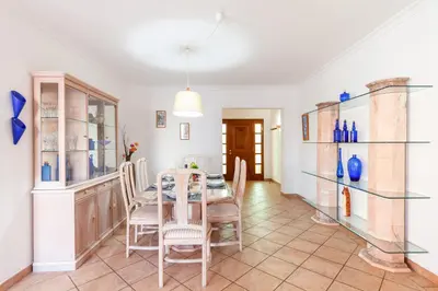a dining room with a table and chairs at Villa Azzurra by Algarve Vacation in Albufeira
