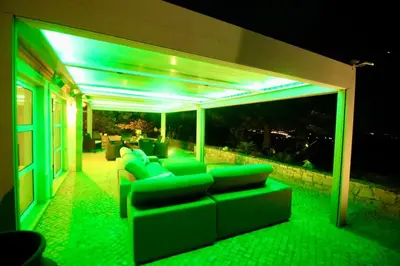 a living room with green lights on a house at Casa Grayson in Loulé