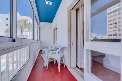 a small room with a table and a chair at Maresia 2 Bedroom Oceanfront Apartment in Quarteira in Quarteira