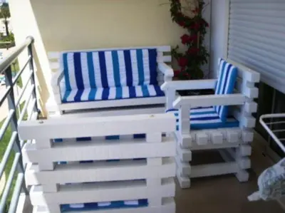 two chairs and a bench on a balcony at Encosta Do Sol in Albufeira