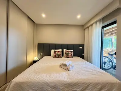 a bedroom with a large bed with two stuffed animals on it at Vilamoura Premium Villa With Pool by Homing in Vilamoura