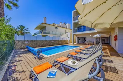 a villa with a swimming pool and a house at Villa Casa Joao by Villa Plus in Albufeira