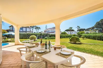 a living room with two couches and a fireplace at Casa Paraiso in Vilamoura