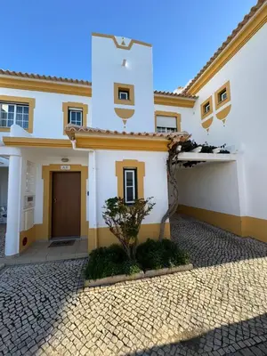 a large white house with a driveway at Casa Vila Sul AE in Roja- Pé