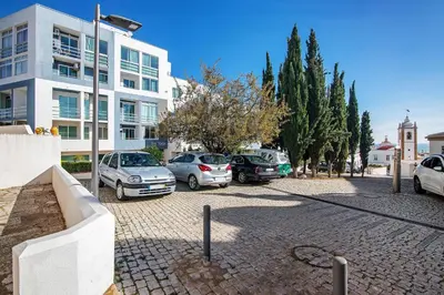 a courtyard of a building with white buildings at Bay View Albufeira in Albufeira