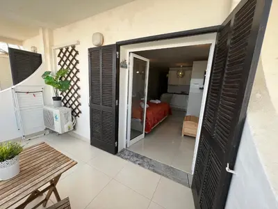 a balcony with a view of the ocean at Paulos Studio in Faro