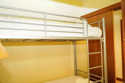 a bunk bed in a room with a bunk bed gmaxwell gmaxwell gmaxwell gmaxwell at Salgados Apartment in Albufeira