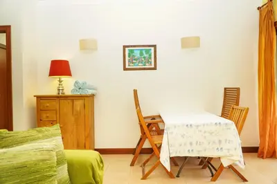a dining room with a table and chairs at Salgados Apartment in Albufeira