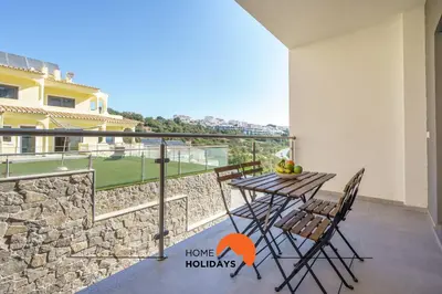 a living room with a couch and a table at #235 New City by Home Holidays in Albufeira