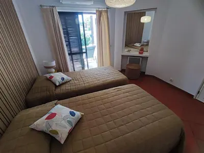 a room with a door and a red tile floor at Albufeira, T1 in Balaia Golf Village, Algarve in Albufeira