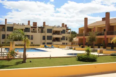 an apartment complex with a swimming pool and a resort at Palm Breeze Terrace Vilamoura in Vilamoura