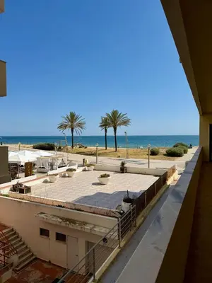 an empty hallway of a building with a large door at Espadarte Quarteira Balcony Flat in Quarteira