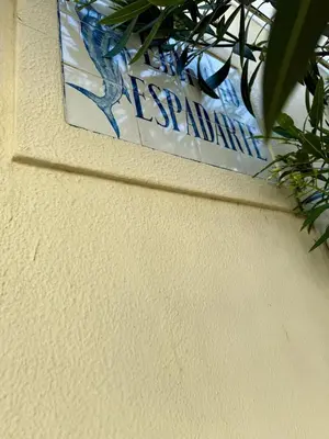 a sign that is on the side of a wall at Espadarte Quarteira Balcony Flat in Quarteira