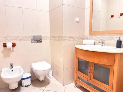 a bathroom with a toilet and a sink at Sea View Apartment by Be Cherish in Albufeira
