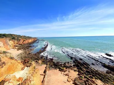 a view of the ocean from a rocky beach at Sea View Apartment by Be Cherish in Albufeira