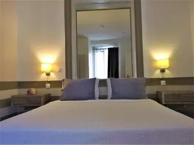 a bedroom with a large bed and a large mirror at Quinta dos Amigos in Almancil