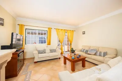 a swimming pool in a villa with a house at Villa Santa Maria in Albufeira