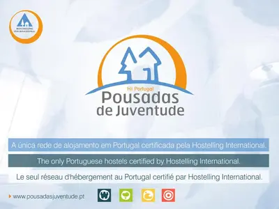 a room with two bunk beds and a fan at HI Faro – Pousada de Juventude in Faro