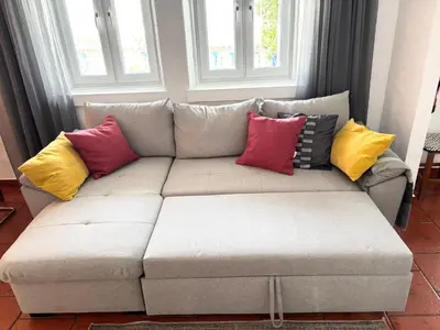 a couch with colorful pillows on it in a living room at Villa 2BDR with sea view, private pool in Albufeira