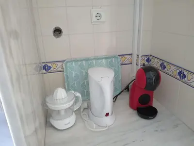 a corner of a bathroom with two appliances at Albufeira INN - Mulatinho V2 in Olhos de Água