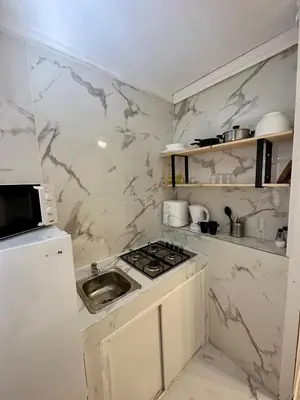 a small kitchen with a sink and a stove at Albufeira flats in Albufeira