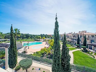 a view of a park with trees and a pool at Apartment Pine Hills Diamante-12 by Interhome in Vilamoura