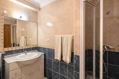 a bathroom with a sink and a shower at Lovely 2-Bed Apartment in Sao Rafael in Albufeira