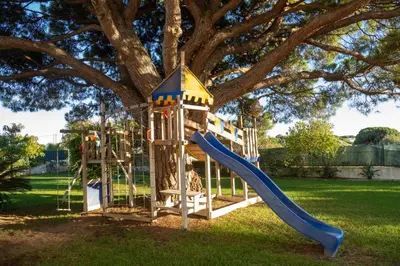 a playground in a park with a slide at Ma Vie La in Vale de Carros