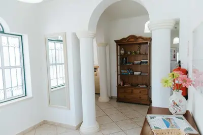 a living room with a couch and a fireplace at Villa Jorge by Ecovillas Albufeira in Galé