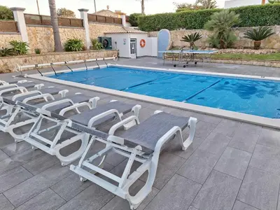a playground with a swing set in a yard at Villa Jorge by Ecovillas Albufeira in Galé