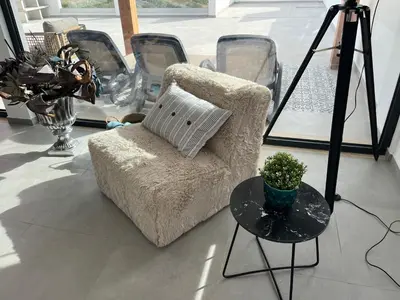 a chair with a pillow on a table in a room at Ocean view by Charmes Penthouse in Albufeira