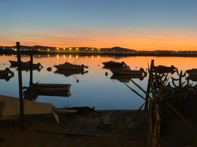 an aerial view of the beach at sunset at Casa da Ria in Faro