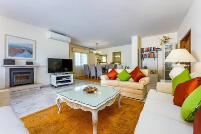 a living room with a couch and a table at Albufeira Villa El-Gharb private 4 Bedrooms in Albufeira