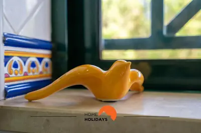 a small orange toy animal sitting on a table at #243 Jardins de Santa Eulália H23 by Home Holidays in Albufeira